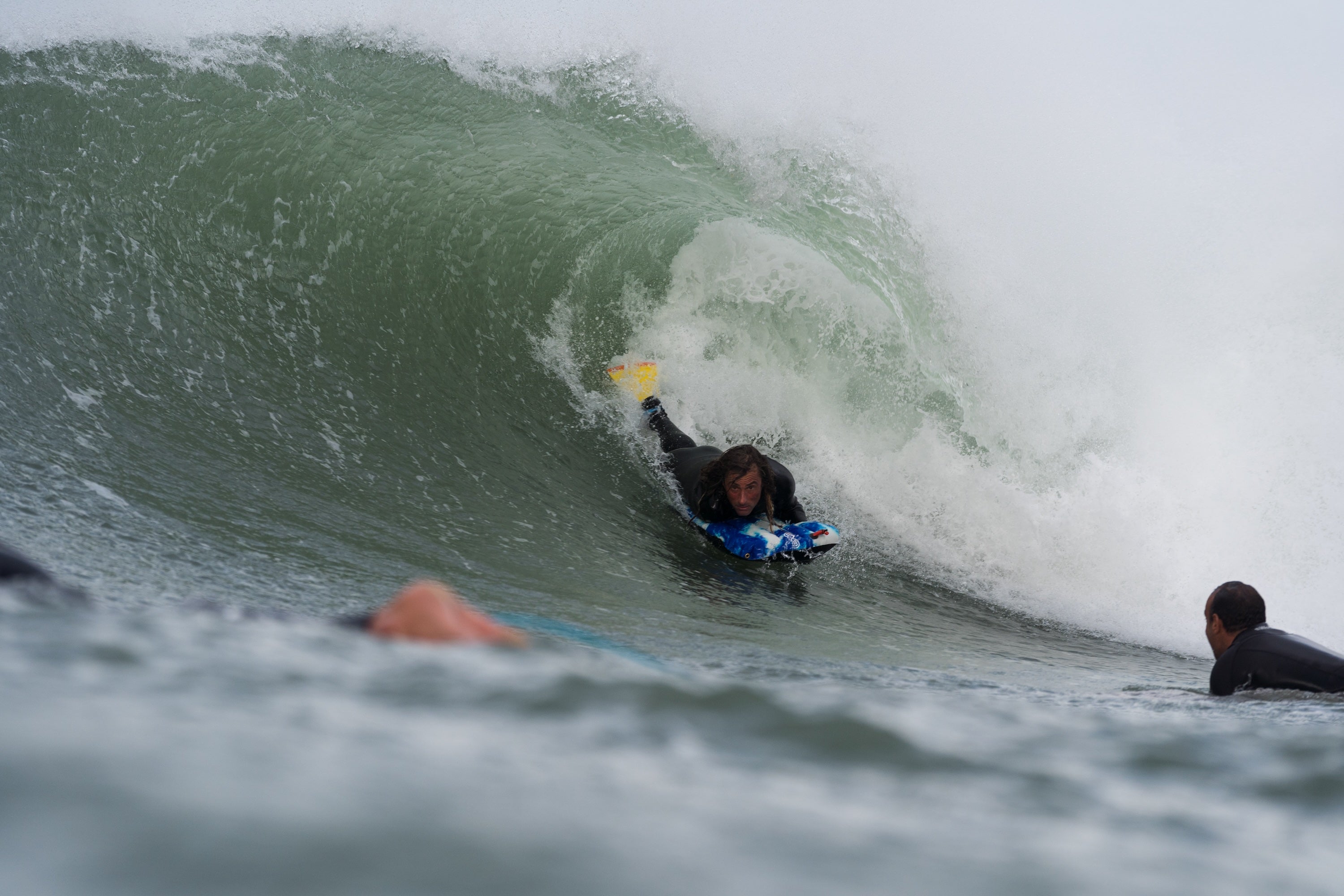 Benoit riding his custom Warpmats surf mat inside a curling wave in Brittany, France